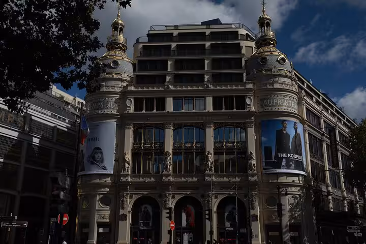 Haussmann-era Paris facade with ornate domes, a highlight on Napoleon III Paris city tour walking route