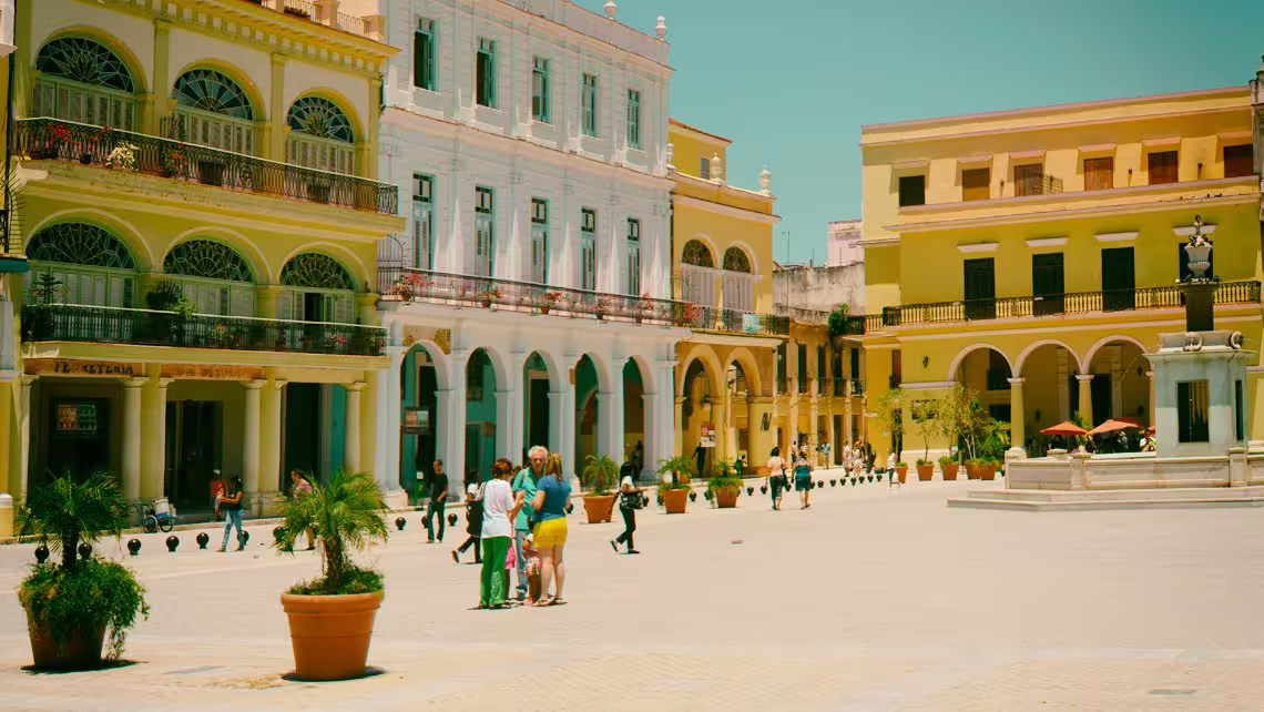 Old Havana plaza with colorful colonial buildings, ideal stop on a 3-hour private Havana guided city tour
