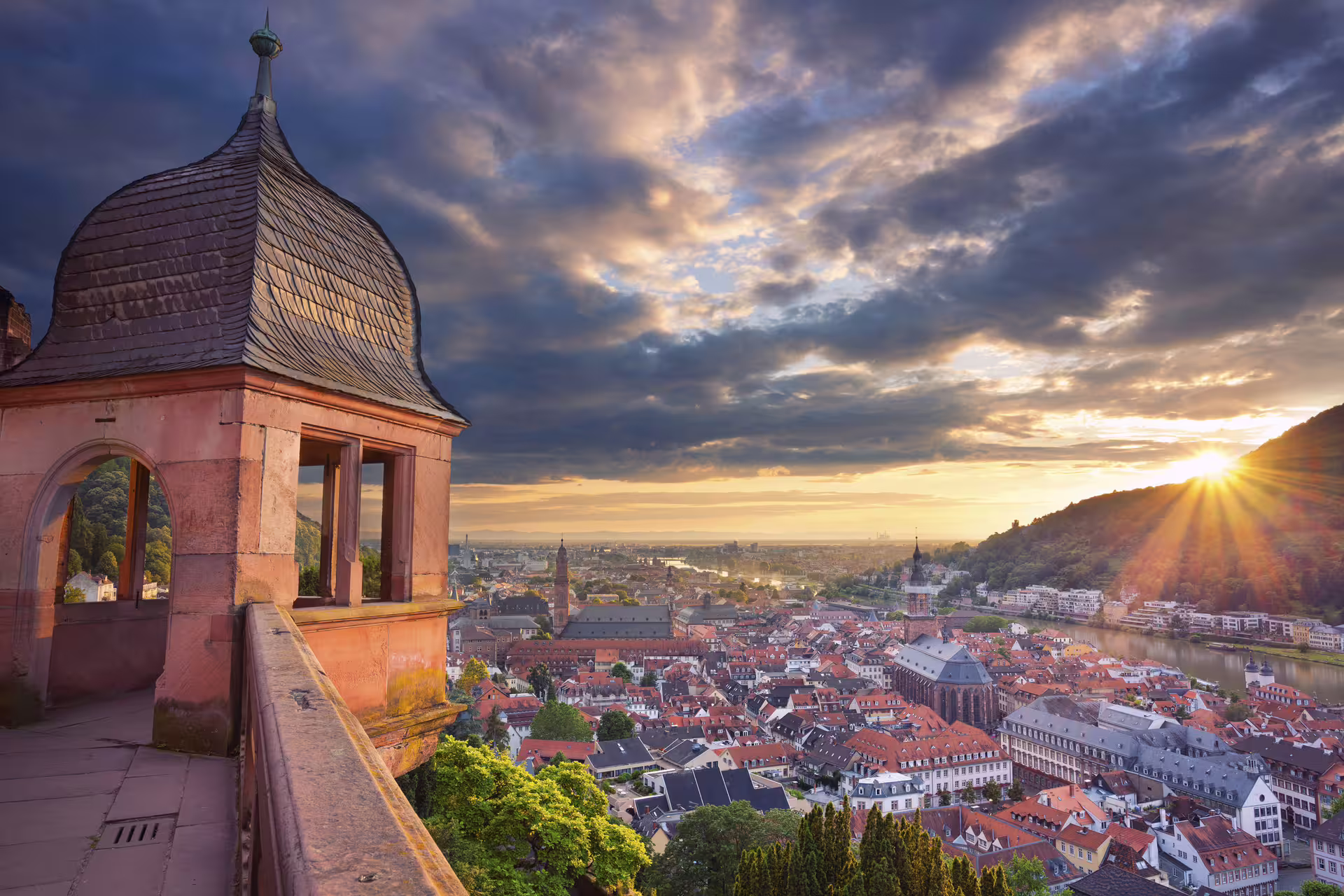 Sunset view over Heidelberg Old Town from the castle terrace, highlight stop on a 1-day walking tour audioguide