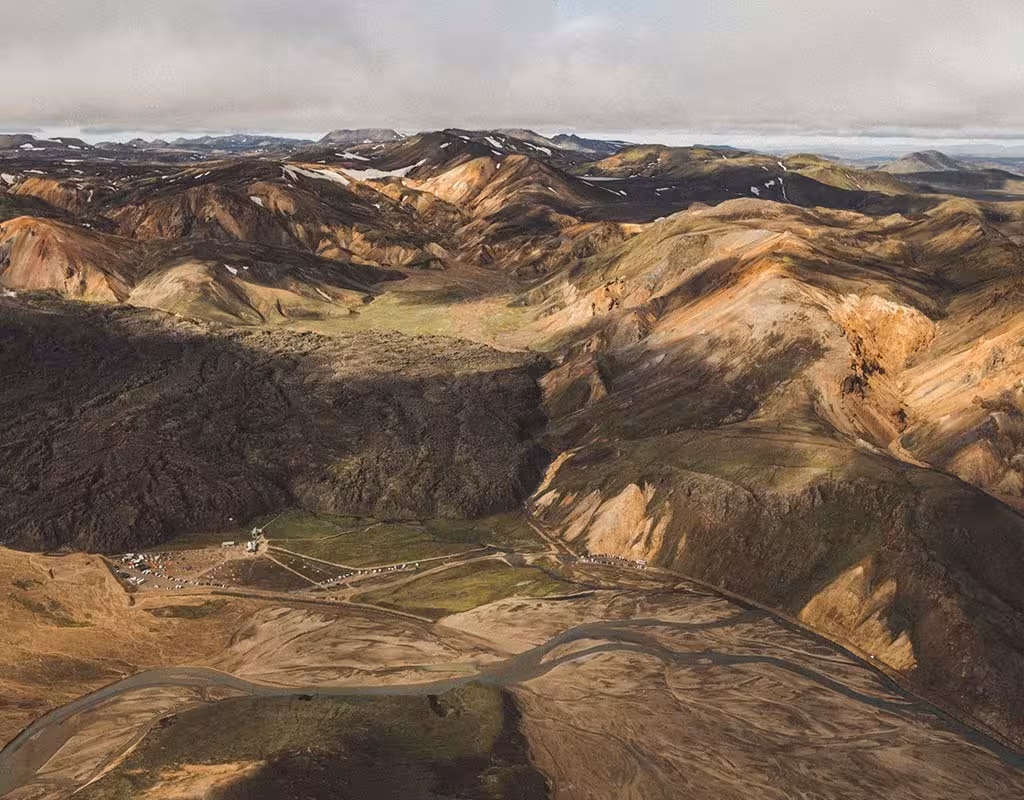Aerial view of colorful rhyolite mountains and glacial river valleys near Skaftafell, Iceland