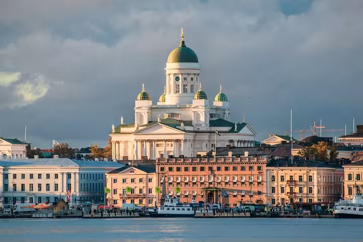 Helsinki Cathedral stands majestically against a cloudy sky, a highlight on the sociologist walking tour of Helsinki.
