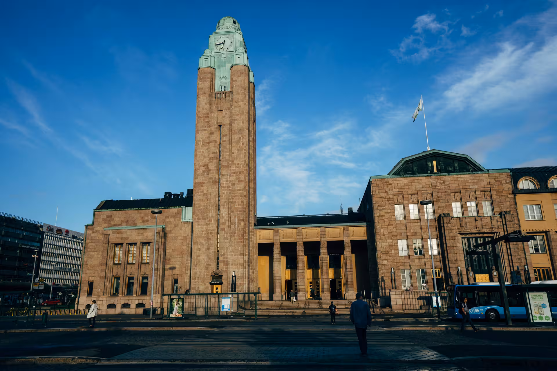 Helsinki Central Railway Station showcasing its iconic clock tower and Art Nouveau design, perfect for architecture enthusiasts.