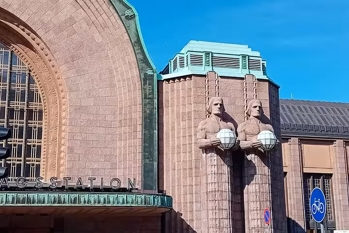 Visit Helsinki's renowned railway station, featuring unique sculptures, on an engaging sociologist-guided walking tour.