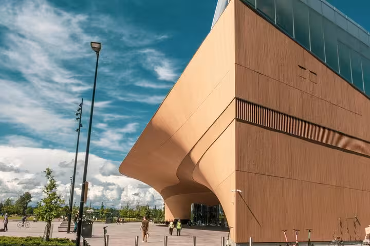 Explore the modern Oodi Library's striking architecture during a Helsinki walking tour guided by a sociologist.