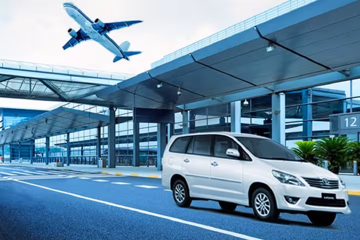 Comfortable minivan pickup at airport terminal for Heraklion Airport to Agios Nikolaos private transfer in Crete