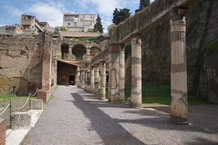 Herculaneum ruins colonnade and courtyard visited on private tour from Naples to Vesuvius, Pompeii and Herculaneum