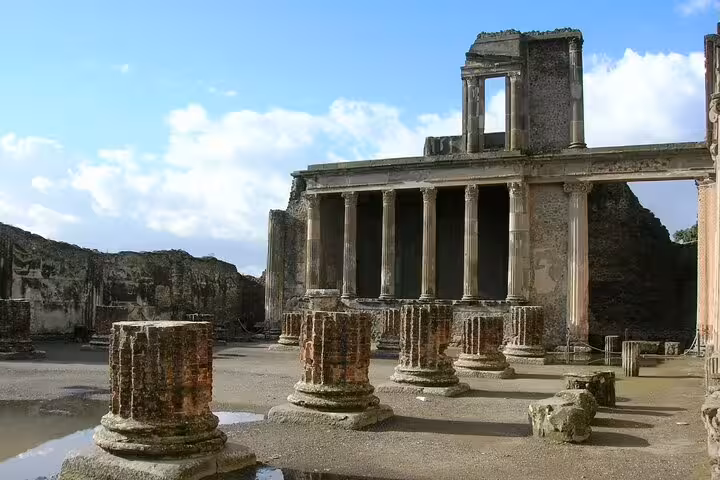 Ruins of Herculaneum columns and temple on a private tour from Naples combining Vesuvius and Pompeii