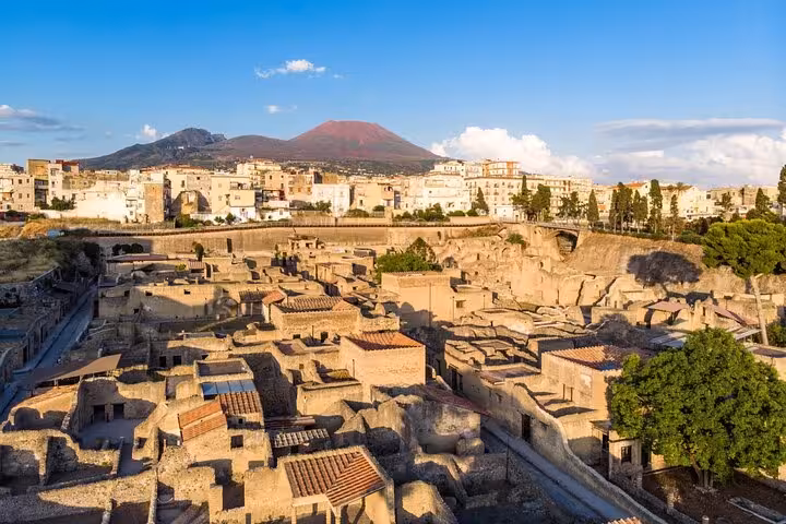 Experience the stunning ruins of Herculaneum overlooking Mount Vesuvius, featured in our Amalfi to Positano tour.