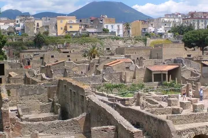 Panoramic view of Herculaneum ruins below Mount Vesuvius on a guided Pompeii Ercolano and winery day trip