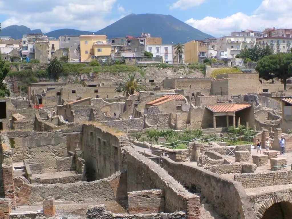 Panoramic view of Herculaneum ruins with Mt Vesuvius and modern Ercolano skyline, visited on guided Vesuvio and winery tours
