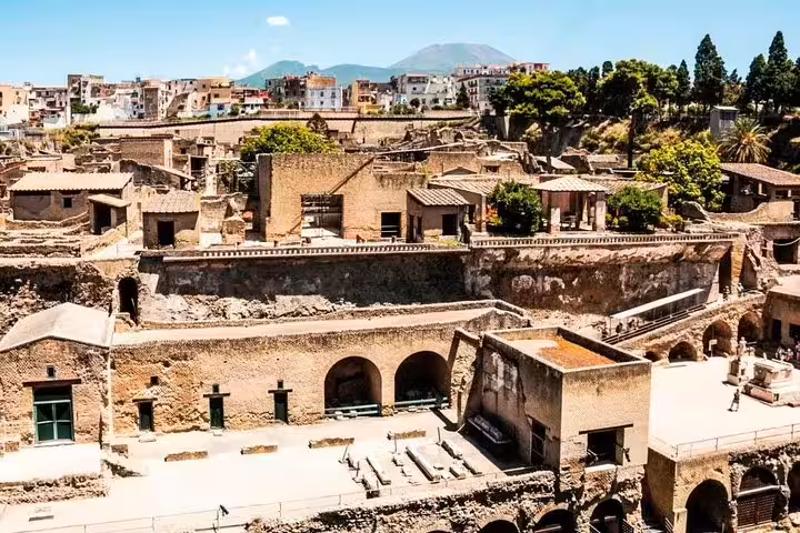 Elevated view of Herculaneum ruins, arches and streets near Naples with Mount Vesuvius on a private half-day history tour