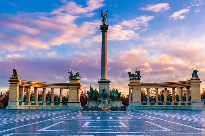 Heroes' Square monument with Millennium Memorial column and colonnades at sunset in Budapest