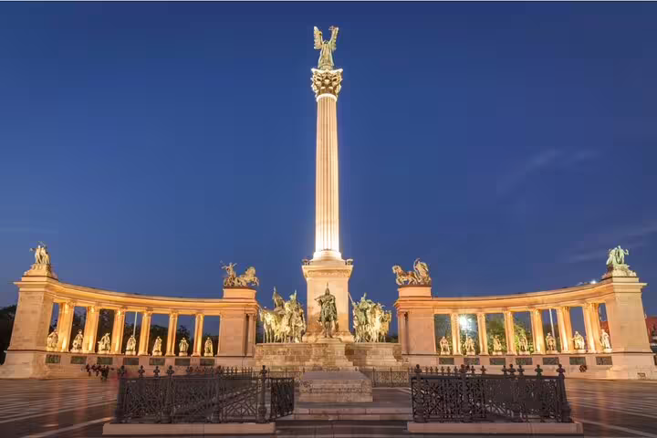 Heroes' Square monument illuminated at night in Budapest, Hungary