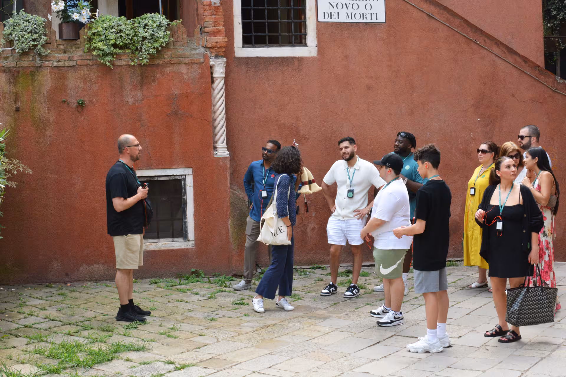 Tour group explores hidden Venice street with local guide, highlighting authentic off-the-beaten-path experiences.