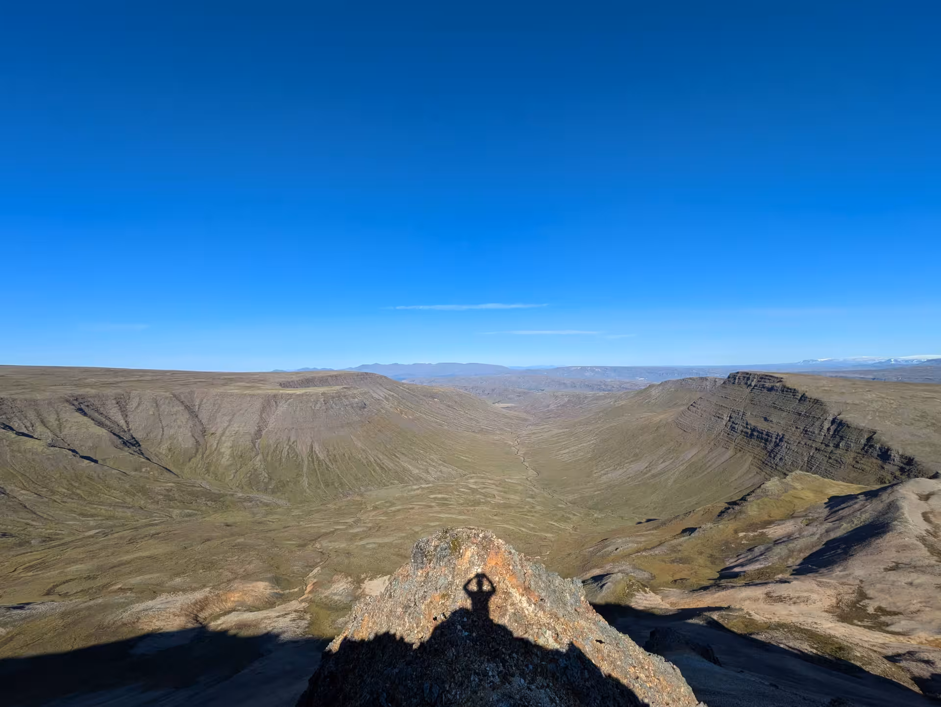 Hiker lying on the edge