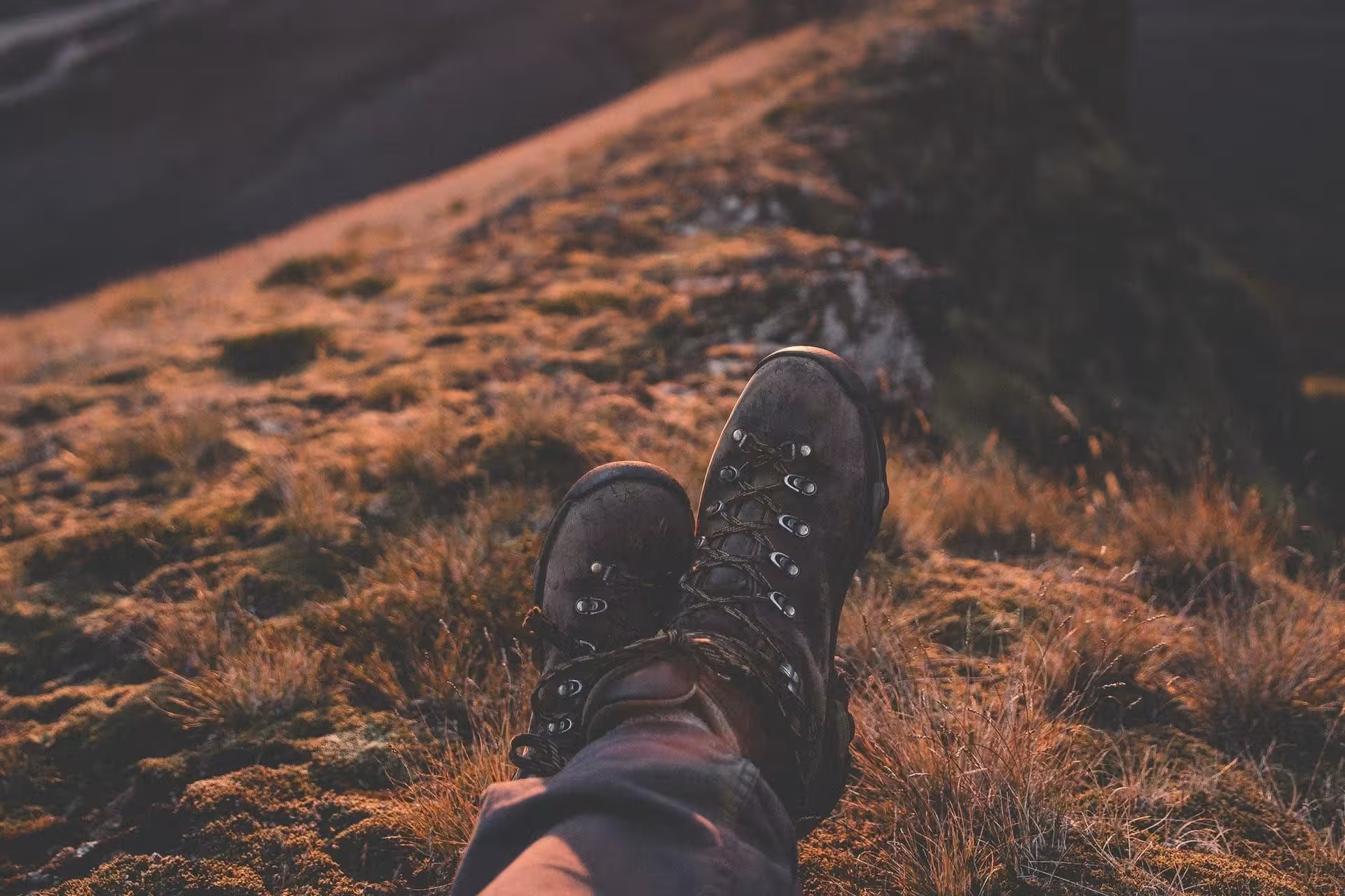 Worn hiking boots resting on mossy mountain terrain in Thorsmork Iceland