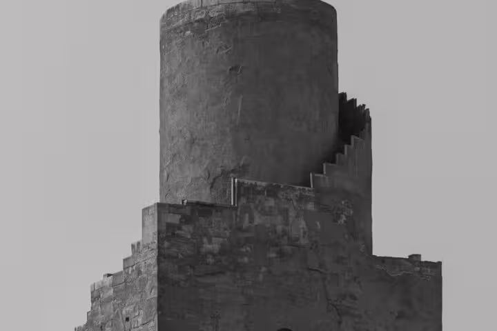 Historic stone minaret tower in Old Cairo, Egypt, a key landmark on the Historical Cairo Mosques tour