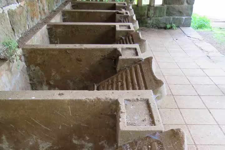 Historic stone washbasins in Madeira, showcasing traditional architecture on a full-day private 4x4 adventure tour.