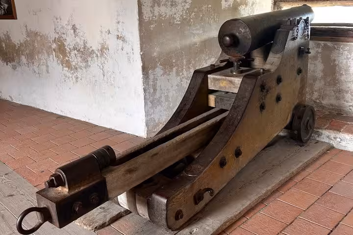 Historic wooden cannon inside Hohenwerfen Castle museum, a highlight on the private Werfen Castle day trip from Salzburg