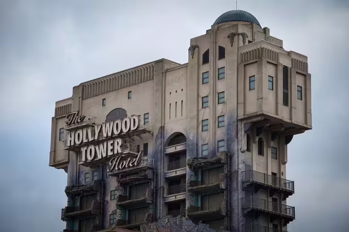 Hollywood Tower Hotel facade at Disneyland Paris theme park under cloudy sky