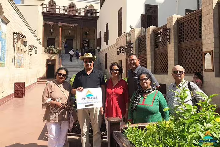 Holy Family Tour Egypt guests at a historic Cairo monastery courtyard during 15 days 14 nights package