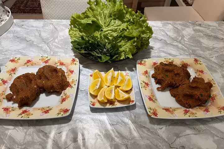 Homemade çiğ köfte served with lettuce and lemon wedges, traditional Turkish meze from a home cooking class