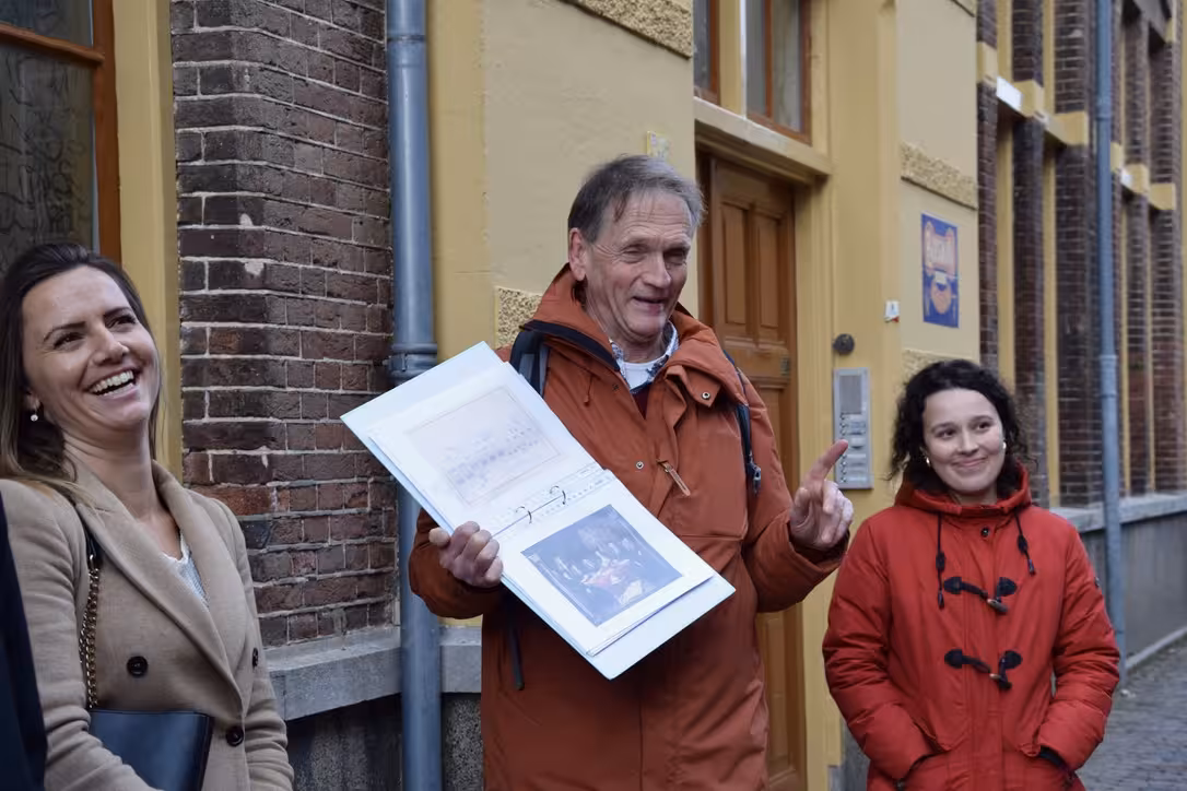 Local guide leads private 2-hour Hoorn walking tour, sharing history on a charming old town street