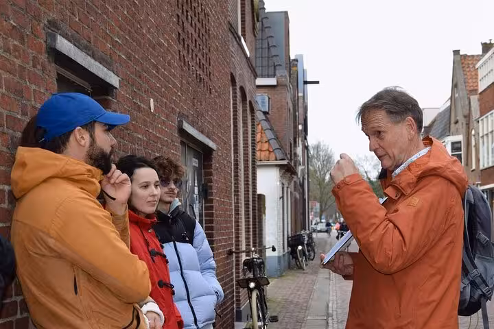 Local guide briefing guests on a Hoorn walking tour, exploring historic Dutch streets and highlights in 2 hours