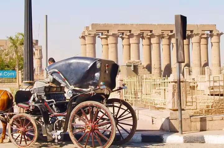Horse-drawn carriage by Luxor Temple columns, classic city tour stop on private Luxor tours Egypt