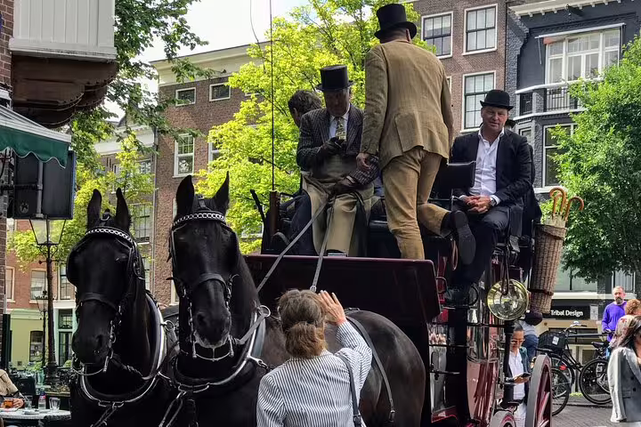 Horse-drawn carriage in central Amsterdam streets, a surprise moment on Your Own Amsterdam random adventure tour