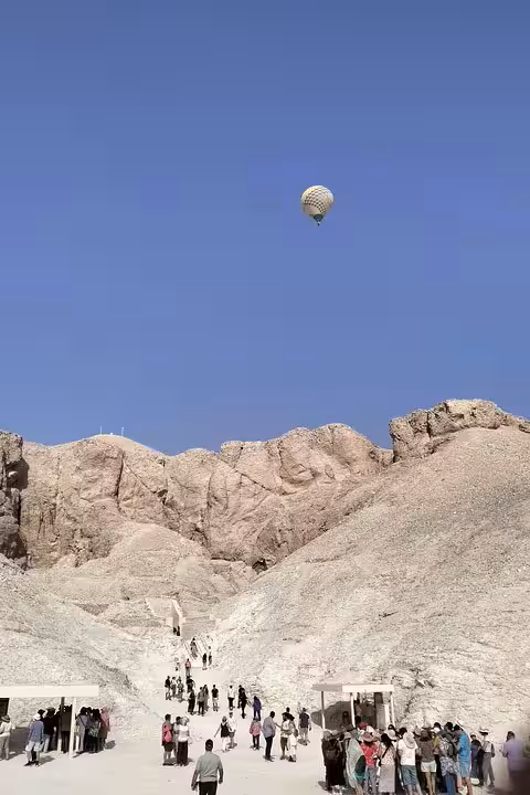 Hot air balloon over Luxor desert cliffs, a highlight of the 8-day Egypt Cairo pyramids Nile cruise tour