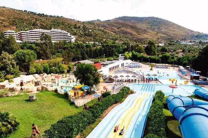 Aerial view of Hotel Costa Verde Cefalù and nearby water park, set in green hills with easy private transfer to Palermo Airport