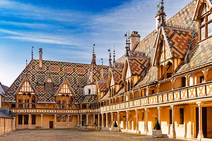 Colorful geometric patterned roof tiles of Hôtel-Dieu courtyard in Beaune, Burgundy, France