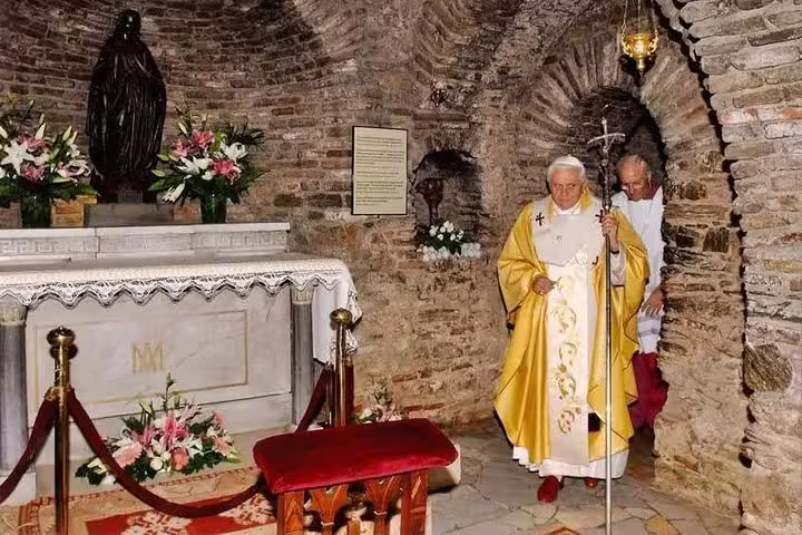 Interior of the House of the Virgin Mary with floral altar on Ephesus private tour from Kusadasi Port.