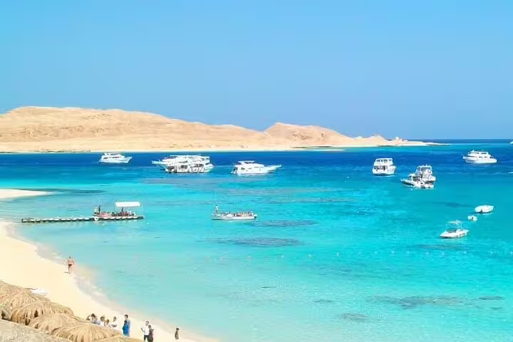 Turquoise lagoon and boats at Hula Hula Island, Red Sea, on VIP snorkeling day trip by boat from Hurghada