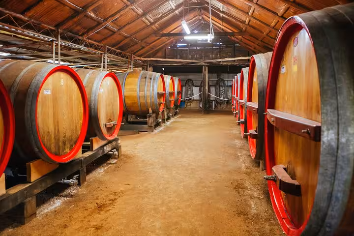 Explore Hunter Valley Winery's rustic barrel room during a premium private group tasting tour experience.
