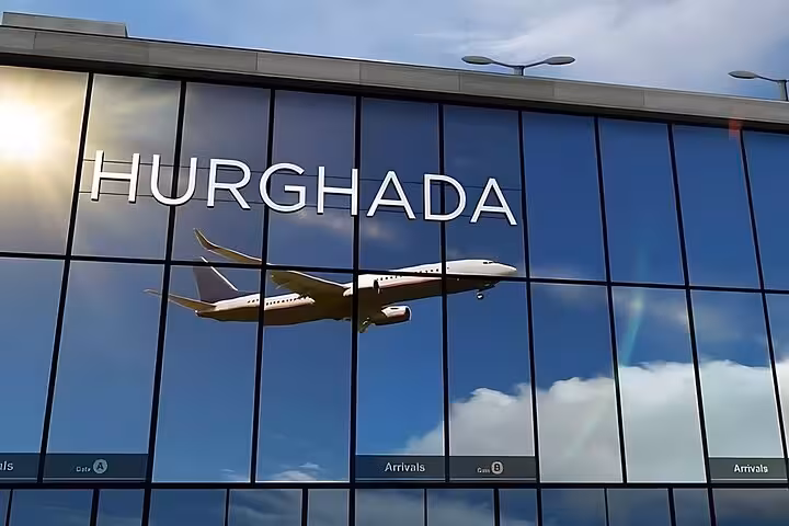 Hurghada airport terminal facade with airplane reflection, ideal for booking fast comfortable private transfer service