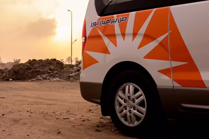 Branded private transfer van at sunset, reliable Hurghada Airport pickup and drop-off to Red Sea resorts
