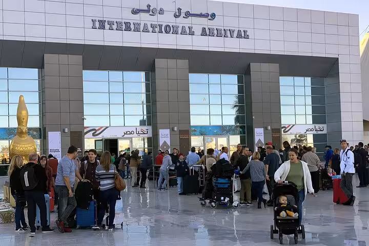 Hurghada International Arrival terminal crowd at pickup area for meet and greet private airport transfer to hotel