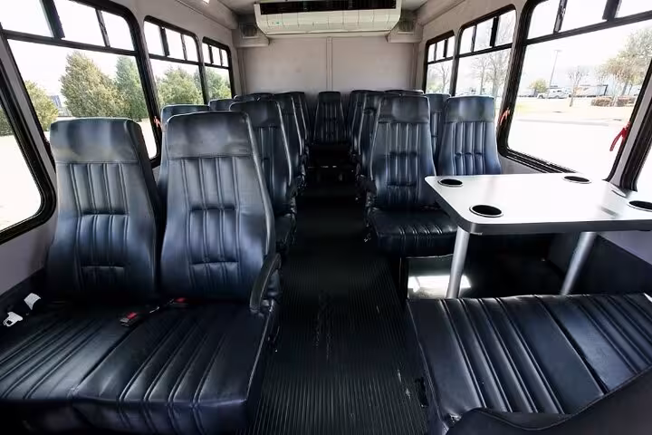 Spacious leather seats inside air-conditioned minibus for private Hurghada to Aswan transfer with luggage space