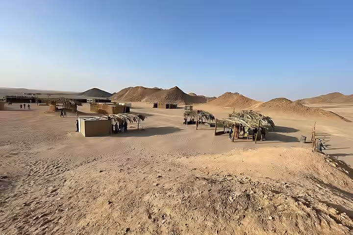Bedouin-style desert camp near Hurghada with shaded huts, a stop on the 6-hour jeep safari BBQ dinner tour