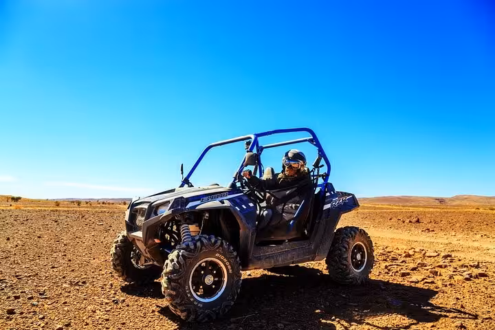 Single-seater buggy driving across Hurghada desert plains, thrilling off-road tour between sea and mountains