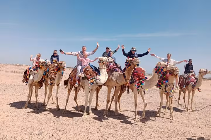 Tourists on camel ride in Giza Desert near Cairo, popular add-on for Hurghada to Cairo day trip