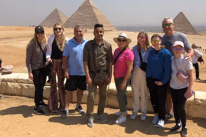 Group photo at Giza Pyramids viewpoint on Hurghada to Cairo tour, guided excursion including Grand Egyptian Museum