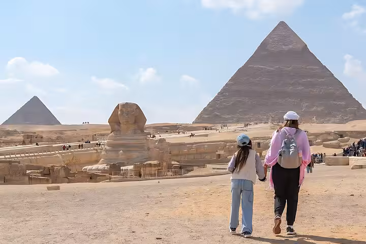 Travelers viewing the Sphinx and Giza Pyramids on Cairo day tour from Hurghada, iconic desert panorama