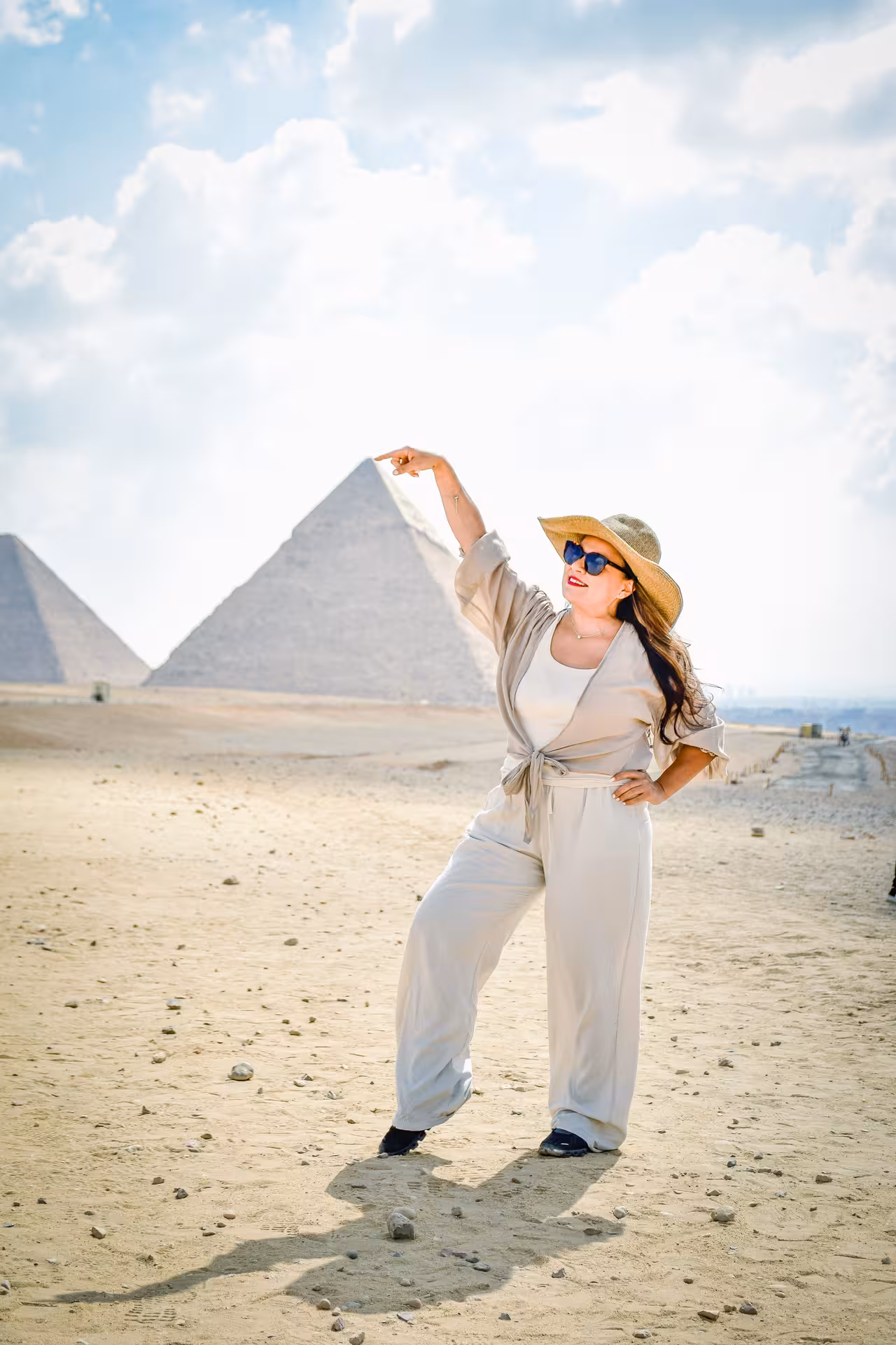 Tourist posing at the Great Pyramid of Giza, Cairo excursion from Hurghada including Sphinx and GEM visit