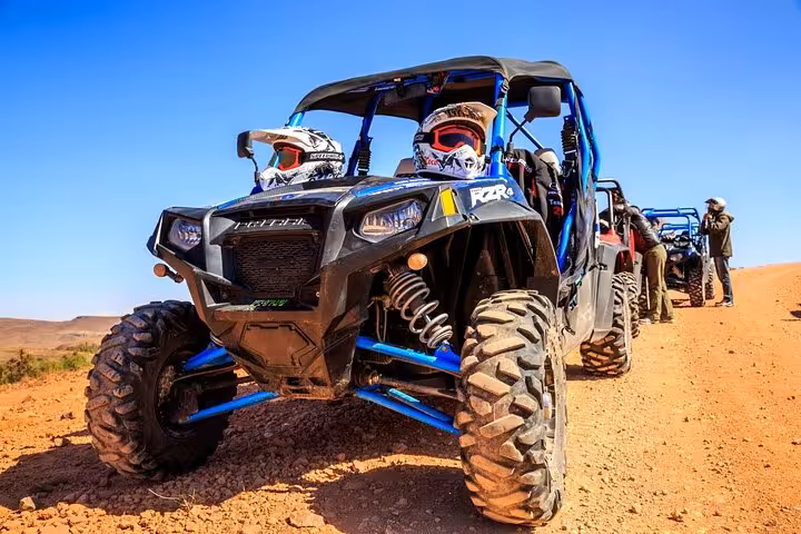 Hurghada desert buggy convoy with helmets on, off-road ride from Red Sea coast to mountain trails