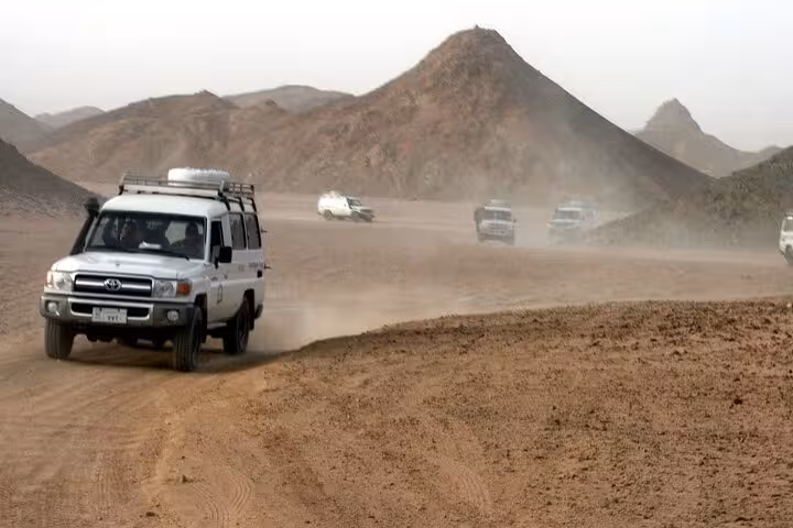 4x4 convoy crossing Hurghada desert tracks, included transfer for quad bike ATV safari with BBQ dinner