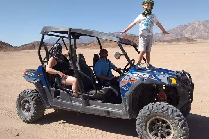 Family in Hurghada desert buggy ride, UTV adventure with transfer and BBQ dinner in Egypt mountains