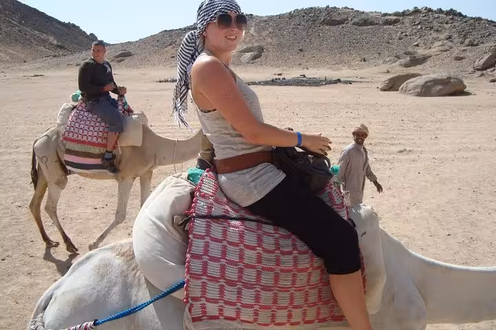 Camel ride stop on Hurghada desert quad bike tour, Bedouin experience with BBQ dinner and hotel transfer
